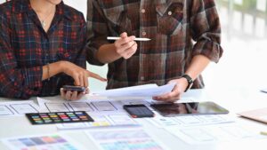 Team of responsive designer designing a wireframe application of mobile