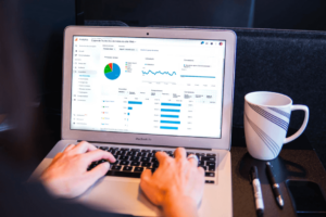 Person typing on a computer (increase blog traffic)