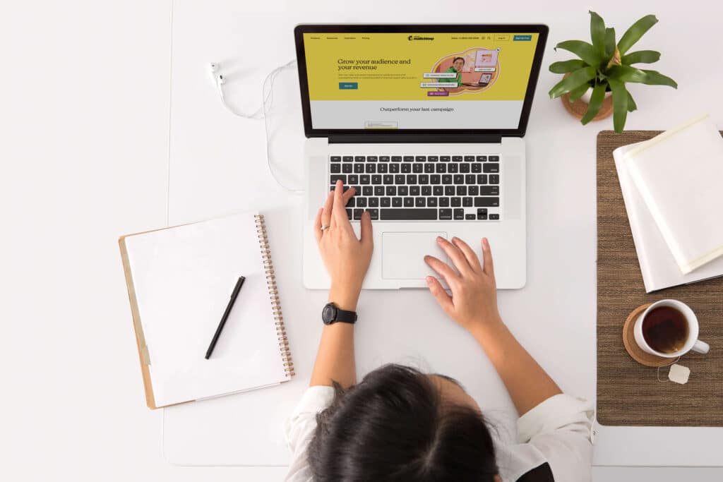 Woman on a laptop researching marketing data analytics for her website