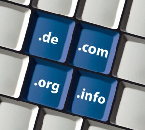 Domain extensions on blue pc keyboard keys - com vs org vs net