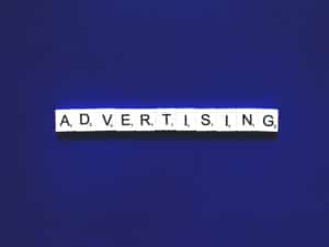"Paid advertising" spelled out in word tiles
