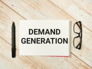the words "demand generation" written on a notepad