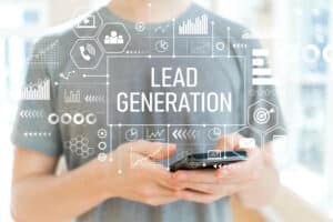 The term "lead generation" overlayed on an image of a man using his cell phone