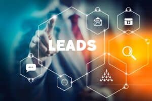 A person pointing to a graphic that says "leads" (b2b lead generation)
