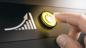 Finger pressing an "on" button to increase paid traffic