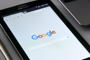 Mobile device showing google home screen (How Much Does it Cost to Advertise on Google?)