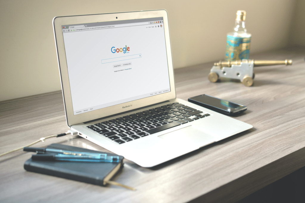 Laptop showing Google home page