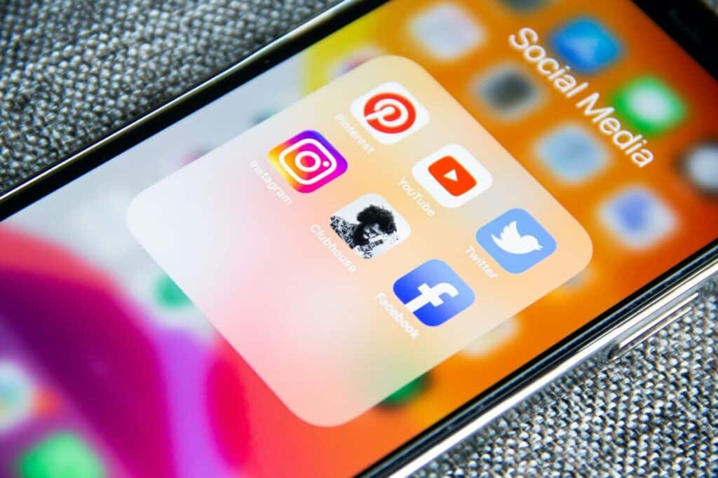 Cell phone showing popular social media apps like Instagram, Pinterest, Youtube, etc.