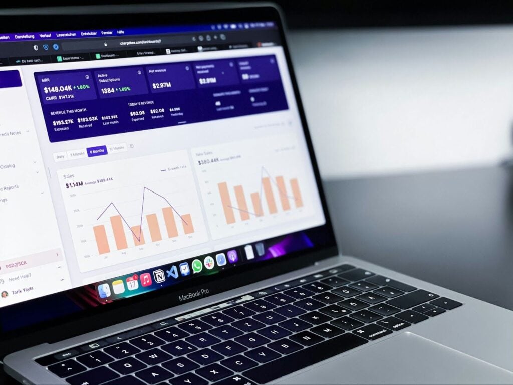 Laptop with paid advertising analytics data pulled up