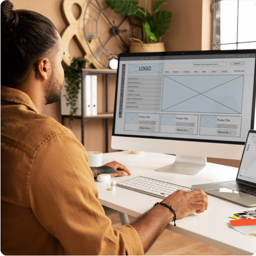 Person looking at a website builder on their computer (website optimization service)