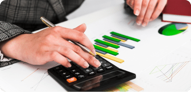 Person with a calculator at a desk