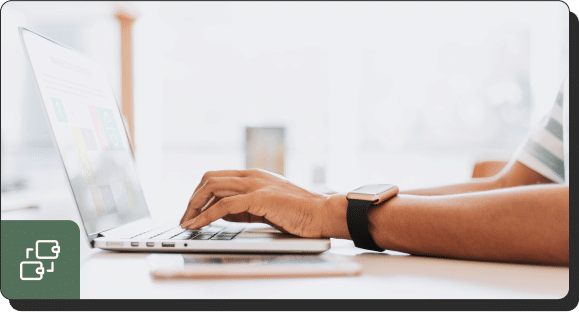 Hands searching SEO services on a laptop