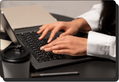 Hands typing on a keyboard
