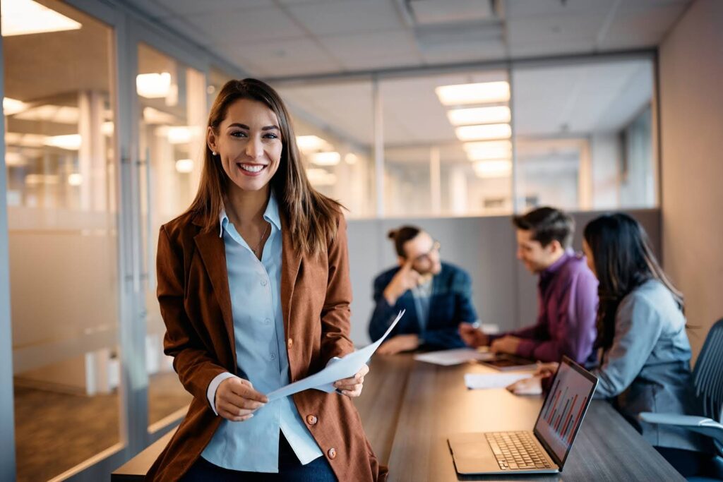 Smiling marketing consultant in meeting with other professional