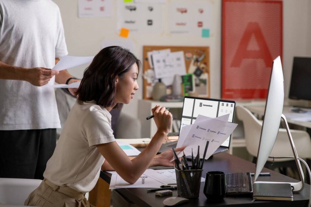 Office worker qa testing a website at a desk