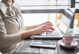 Woman typing on a laptop