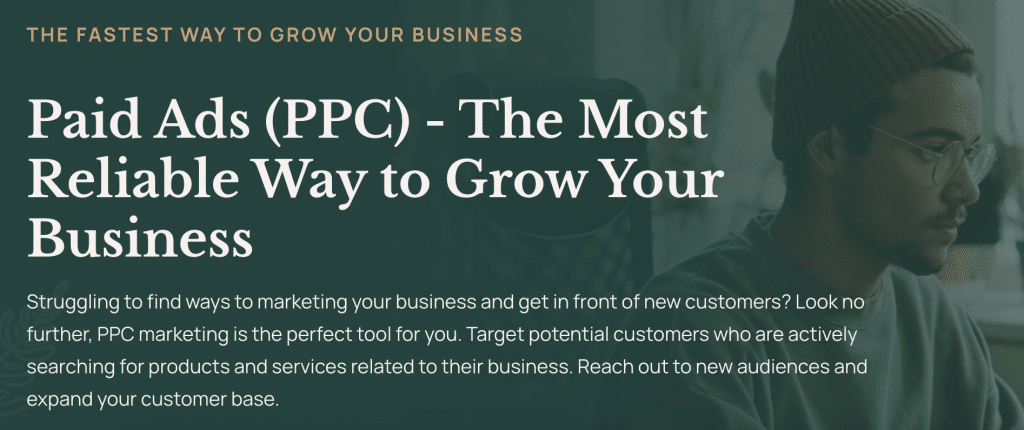 A man in glasses sits in front of a computer. Text on screen promotes PPC advertising as the most reliable way to grow a business, highlighting how targeted marketing and PPC outsourcing help reach new customers.